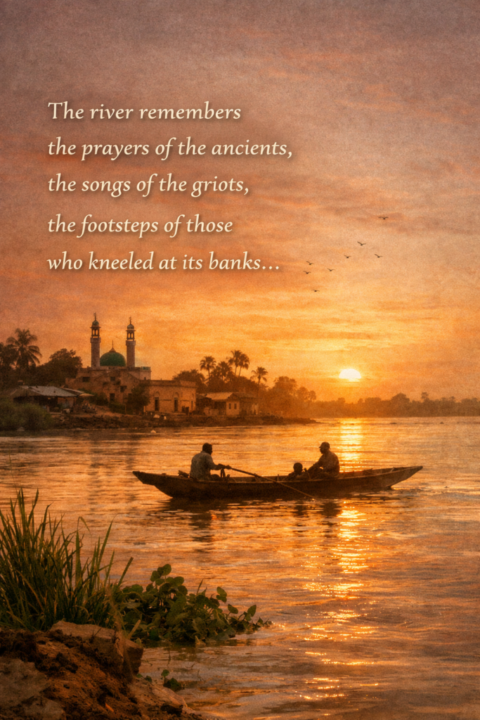 Sunset over a wide West African river with two fishermen in a narrow wooden boat; golden light ripples on the water as birds wheel overhead and a distant village mosque silhouette rises along the far bank. Overlaid text reads: “The river remembers the prayers of the ancients, the songs of the griots, the footsteps of those who kneeled at its banks…”